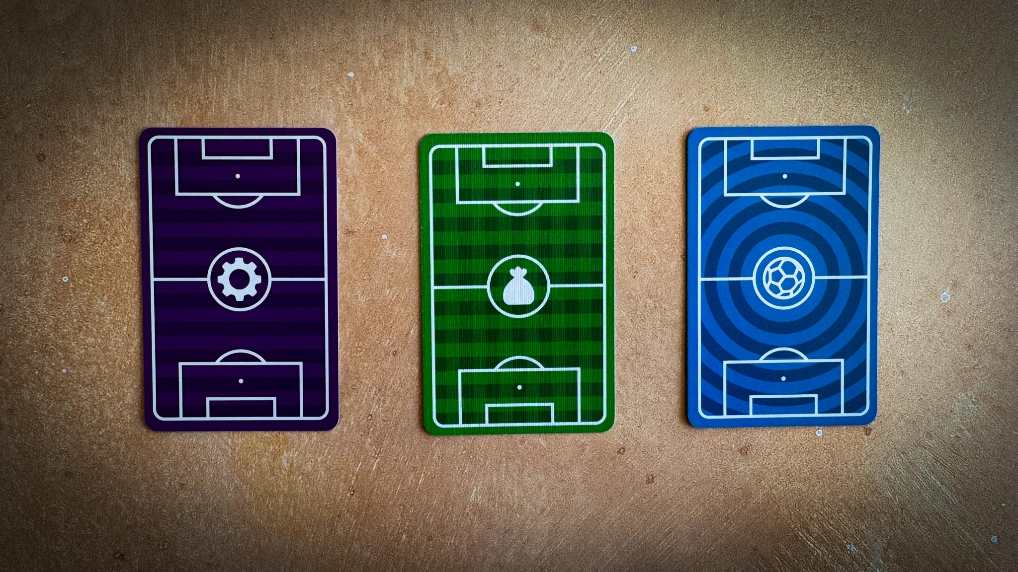 Best Eleven 2025 board game components showing soccer player cards, manager boards, and formation layouts for strategic tableau building gameplay