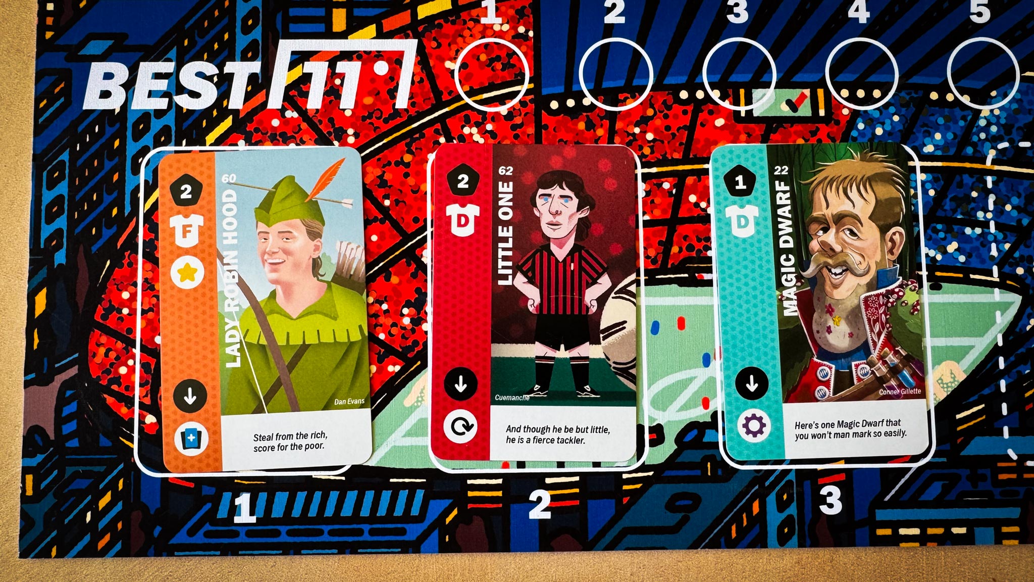 Black Forest board game components showing resource wheels, wooden meeples, and medieval artwork by Uwe Rosenberg