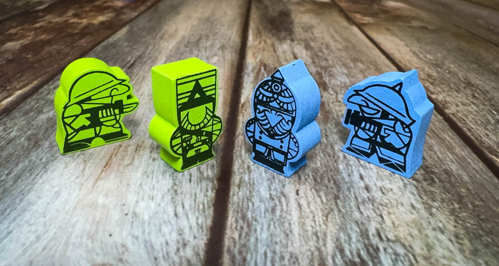 Gruntz board game components showing wooden meeples