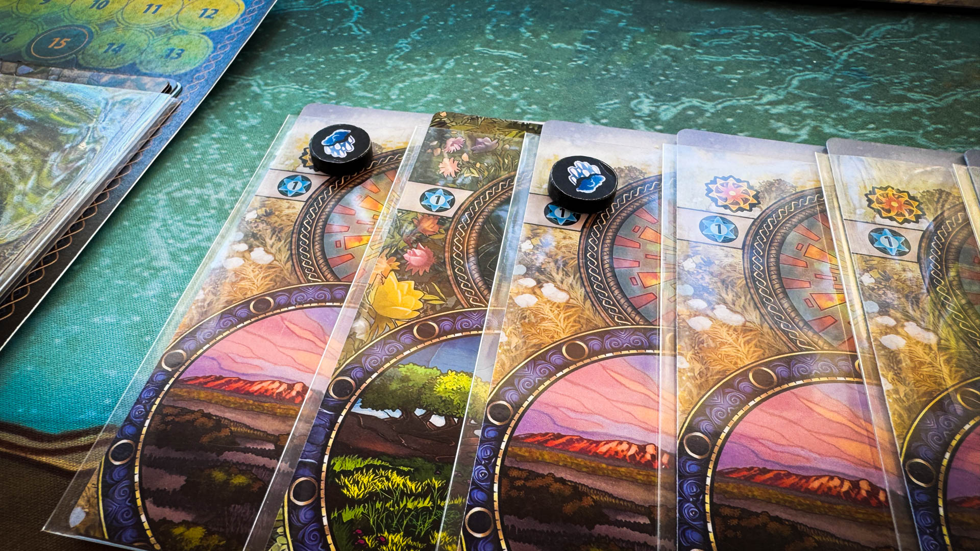 Mystic Lands board game with stained glass card art and Vale Map journey board