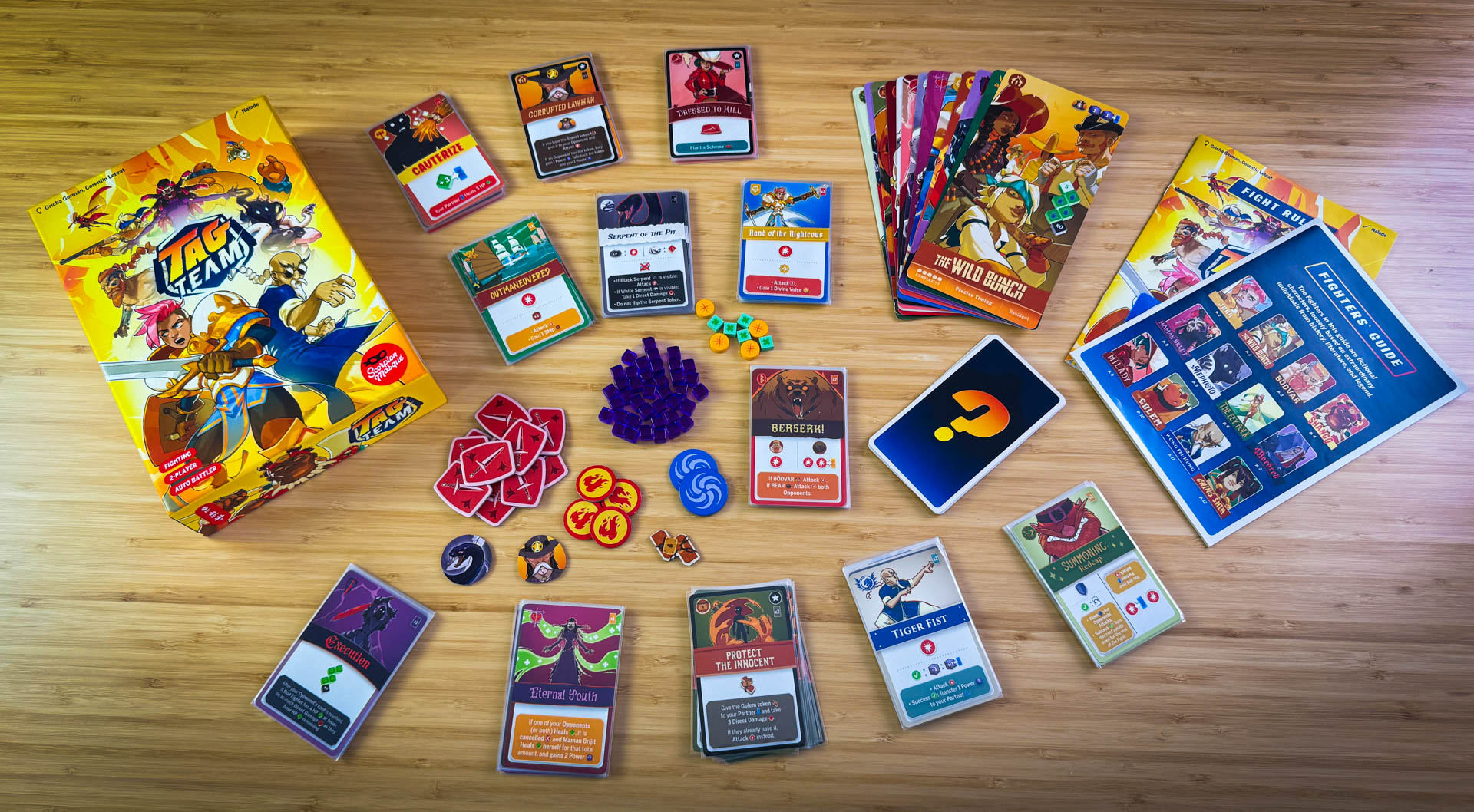 All components 
Tag Team board game review featuring asymmetric fighters and strategic deck building mechanics