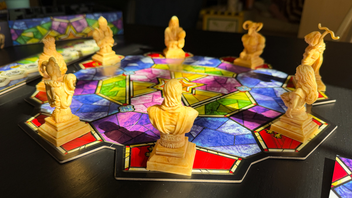 Enthrone — Board and Figures Enthrone stained glass board with 8 sculpted figures dramatic low angle view