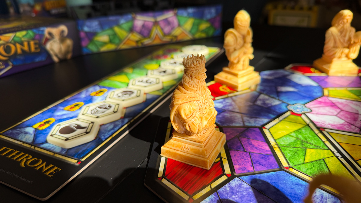 Enthrone — King Figure Enthrone King figure close-up with position track and stained glass board in background