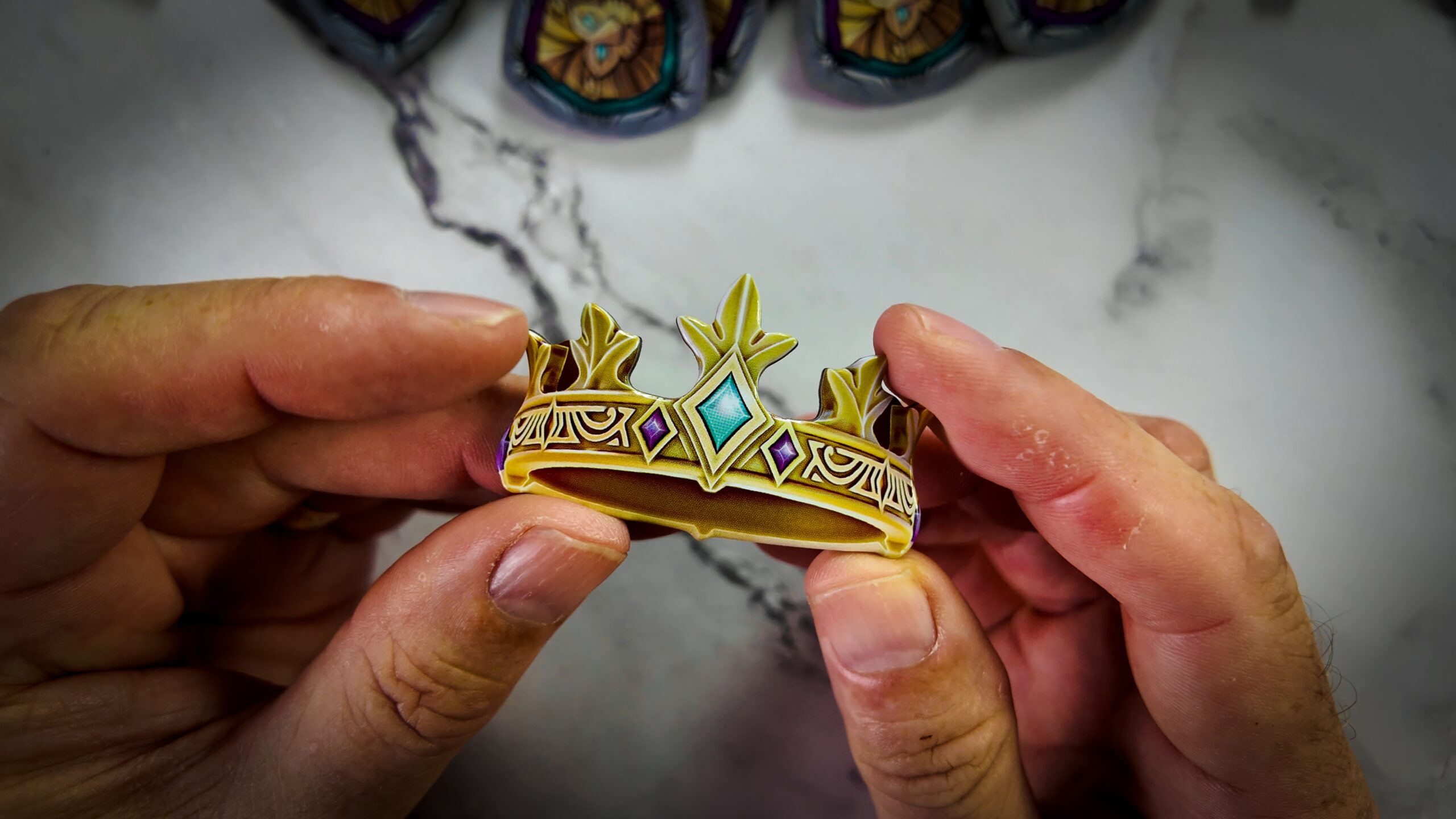 The three cardboard blades dividing the Avalon pool of chips in the Excalibur board game.