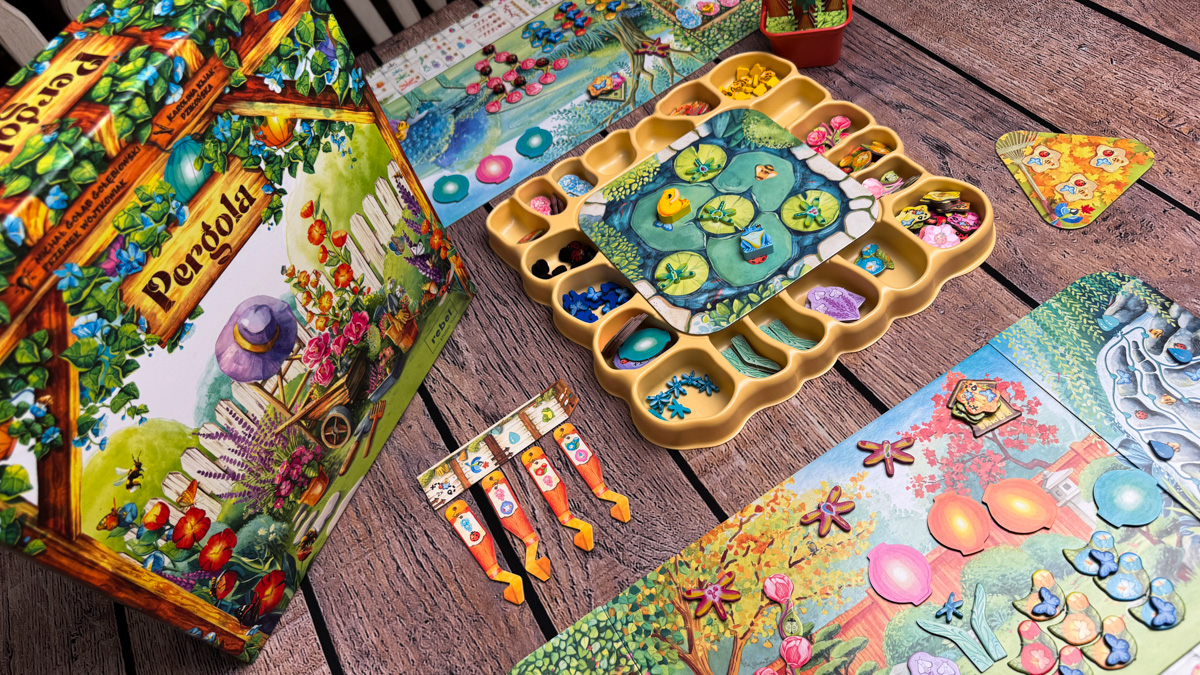 The Pergola board game box and components laid out on a table.