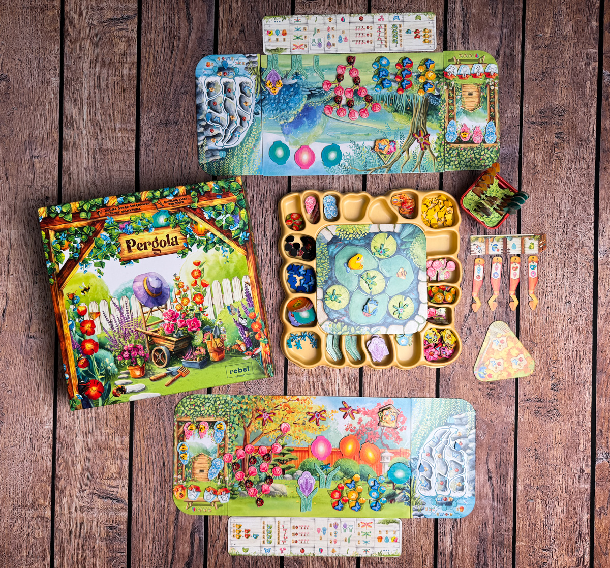 A detailed shot of the player pots and water droplet tokens in Pergola.